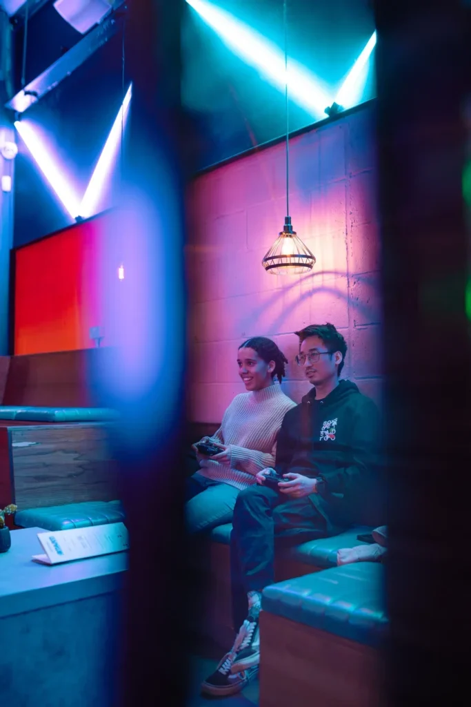 Two guests enjoying a console game at Platform
